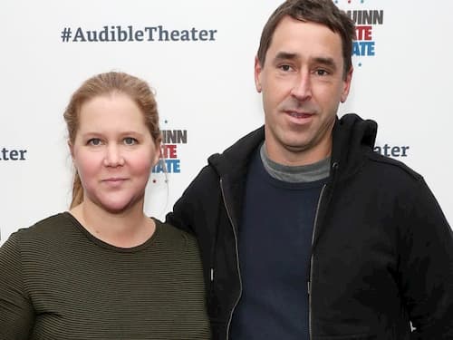 Chris Fischer and his wife Amy Schumer